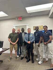 Photo of Council and Chief McCloskey after the swearing in. From left to right, CM Chapman, Mayor Lobdell, CM Bangura, Chief McCloskey, CM Wiggins, CM Sharif